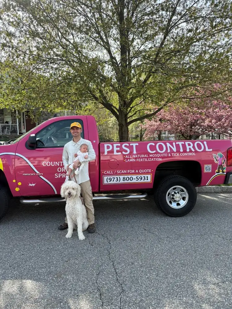 Joey Mantione, founder of Pops Pest Control, with service truck