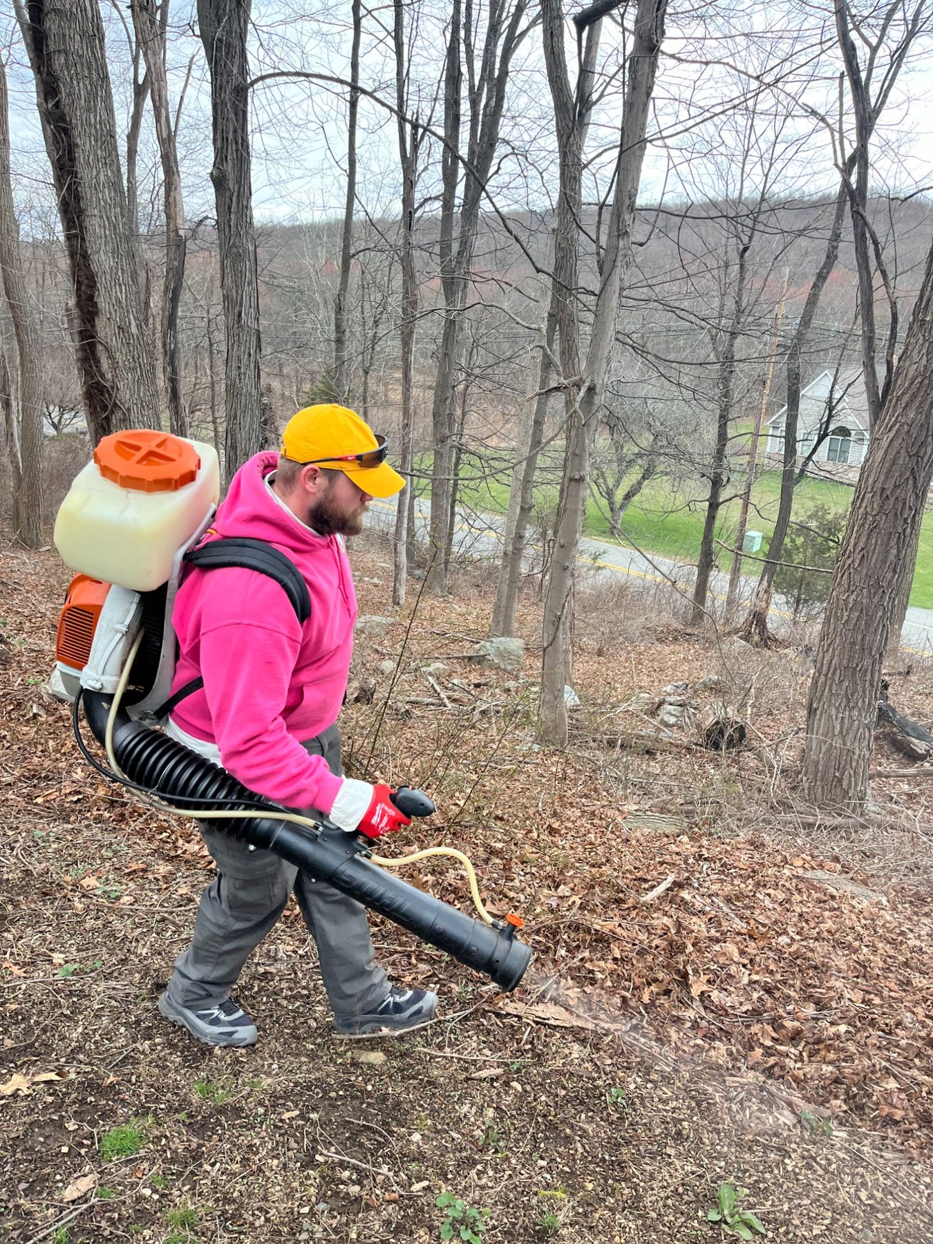 Pops Pest Control team treating wooded property for ticks and mosquitoes