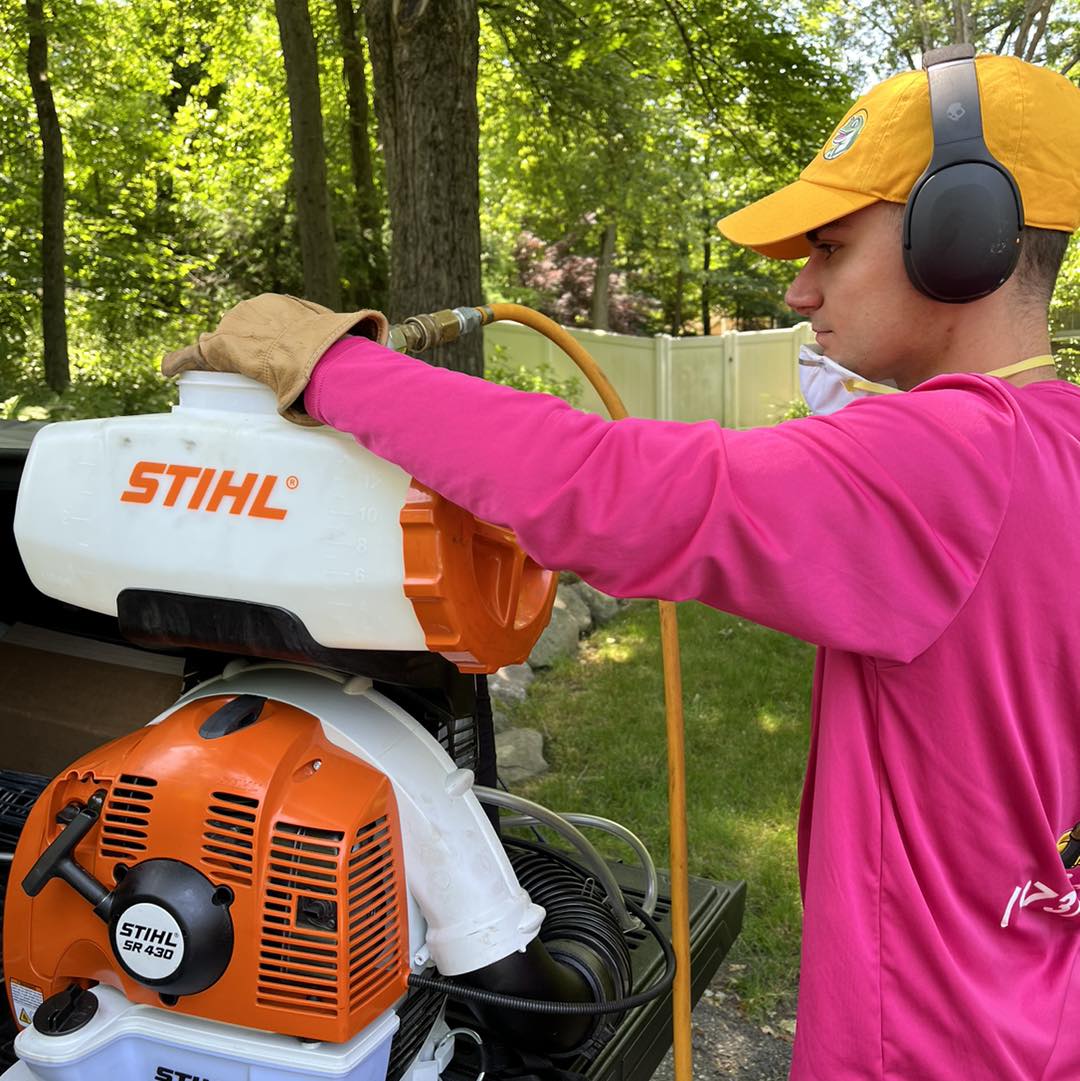 Pops technician preparing botanical spray treatment