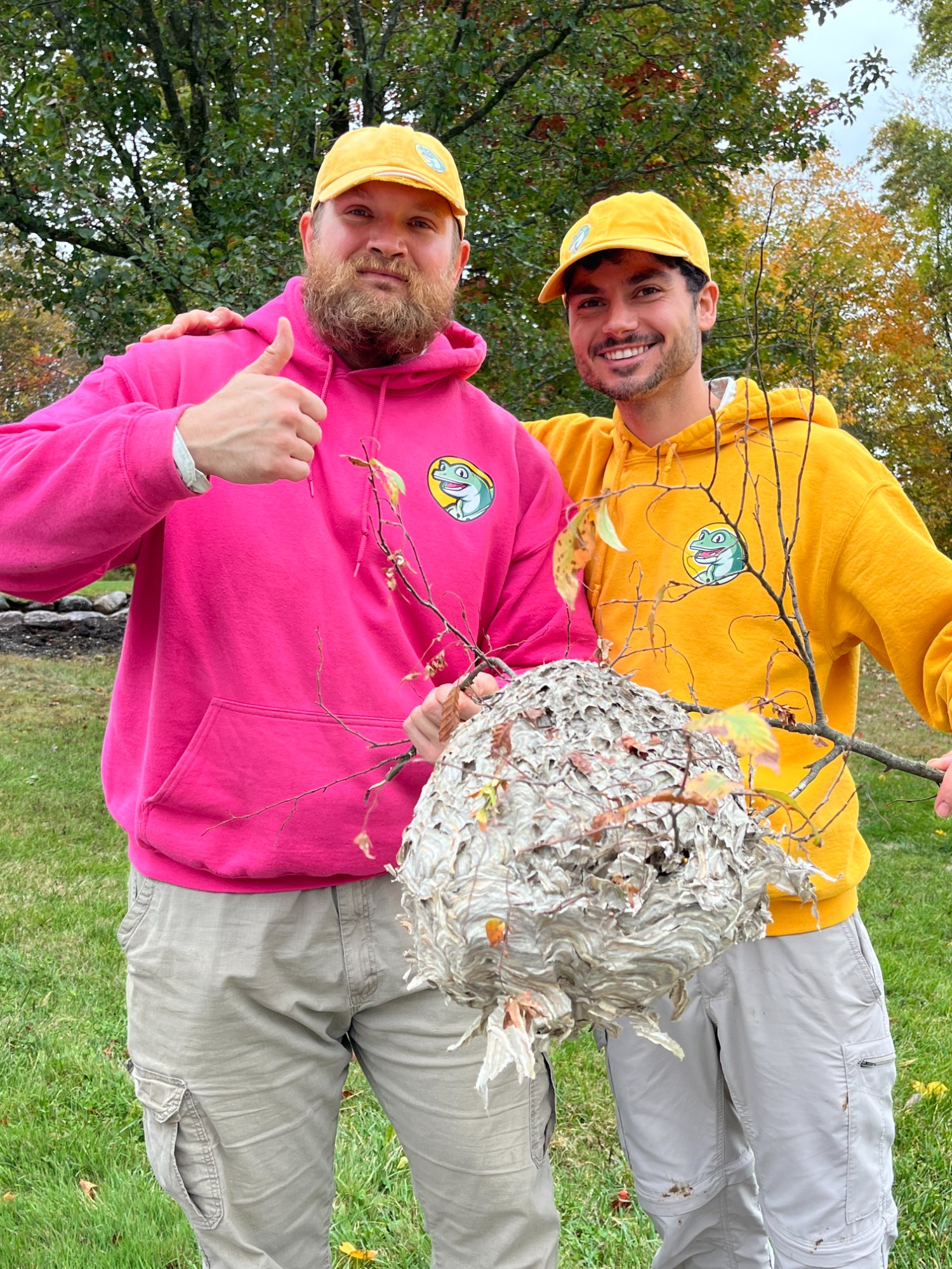 Pops team holding removed hornet nest