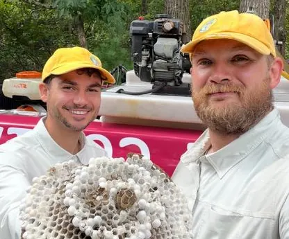 Pops team holding removed hornet nest